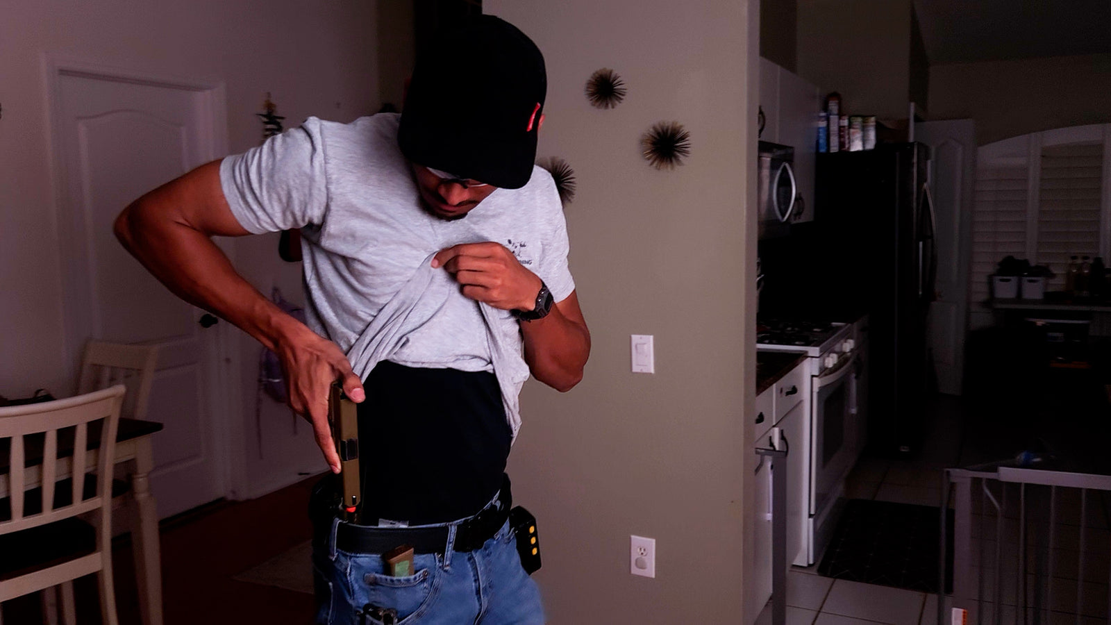 A man practicing concealed carry shooting with the Umarex G19X Airsoft Gas Blowback pistol